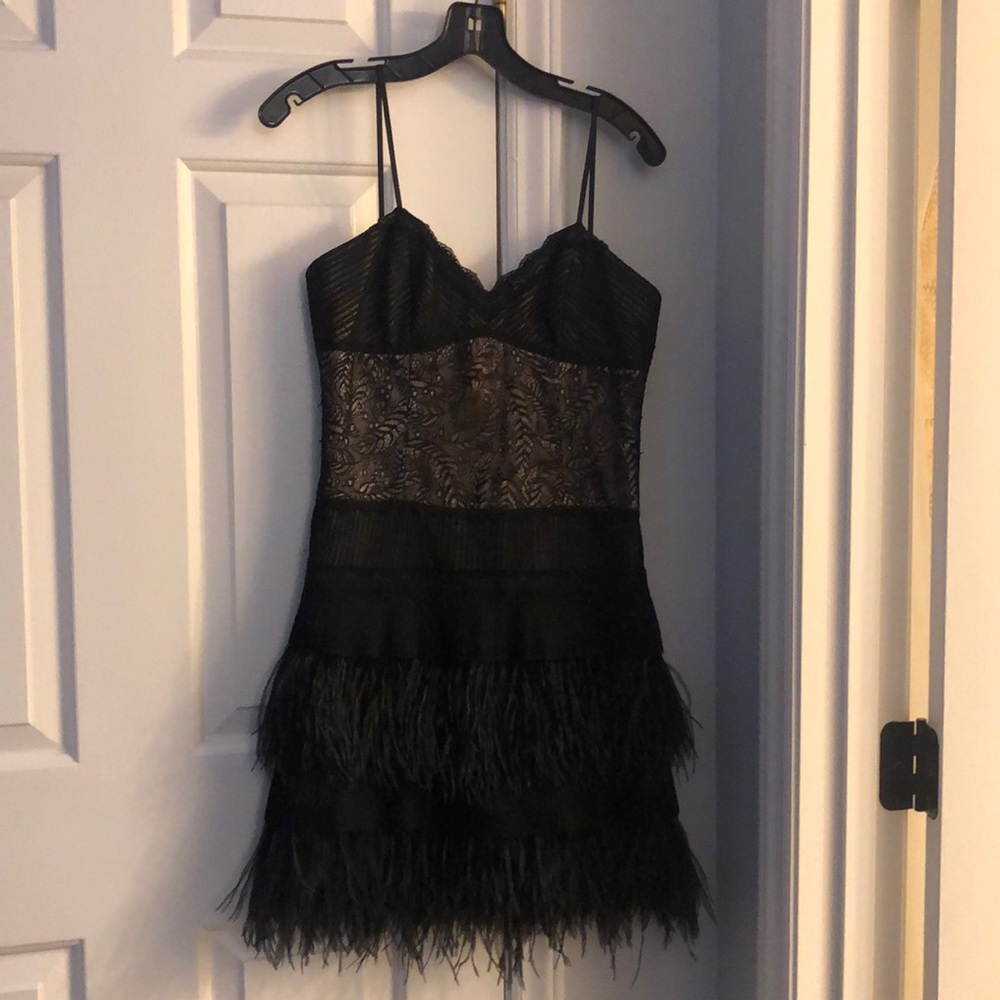 Black cocktail dress with feathers